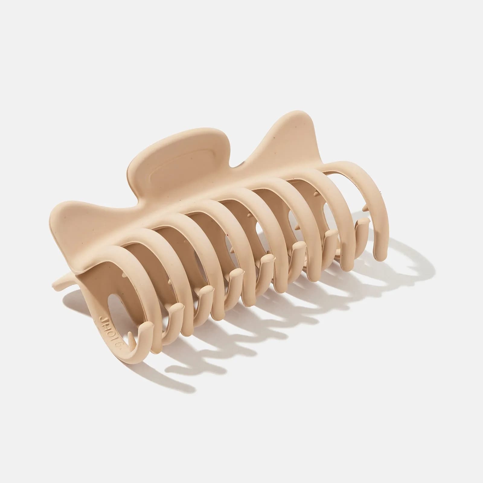 Beige hårklämma