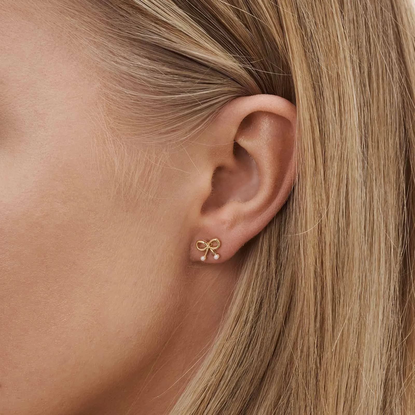 6 guldfärgade studs - olika motiv 1 2