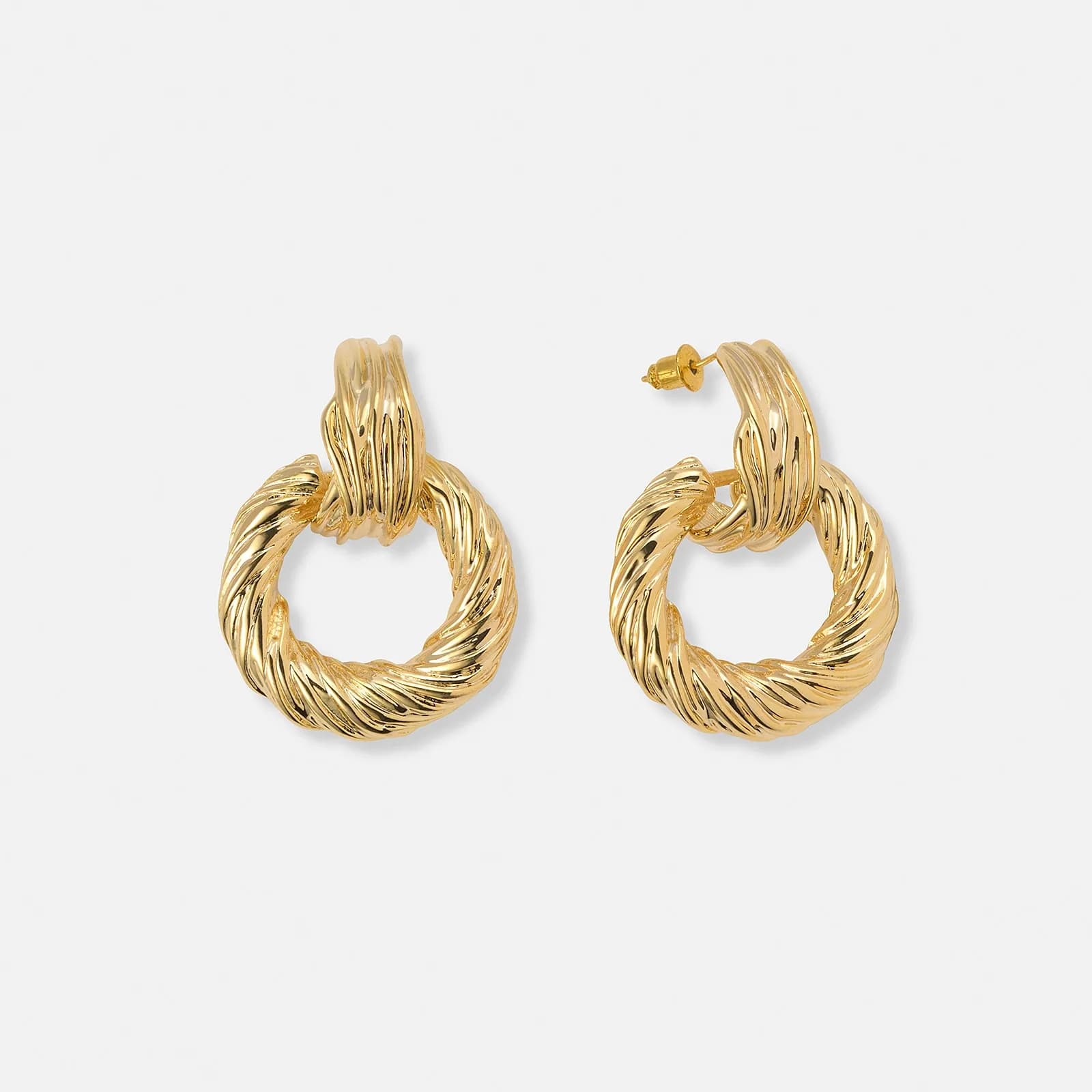 Guldfärgade örhängen vridna ringar - 40x30 mm