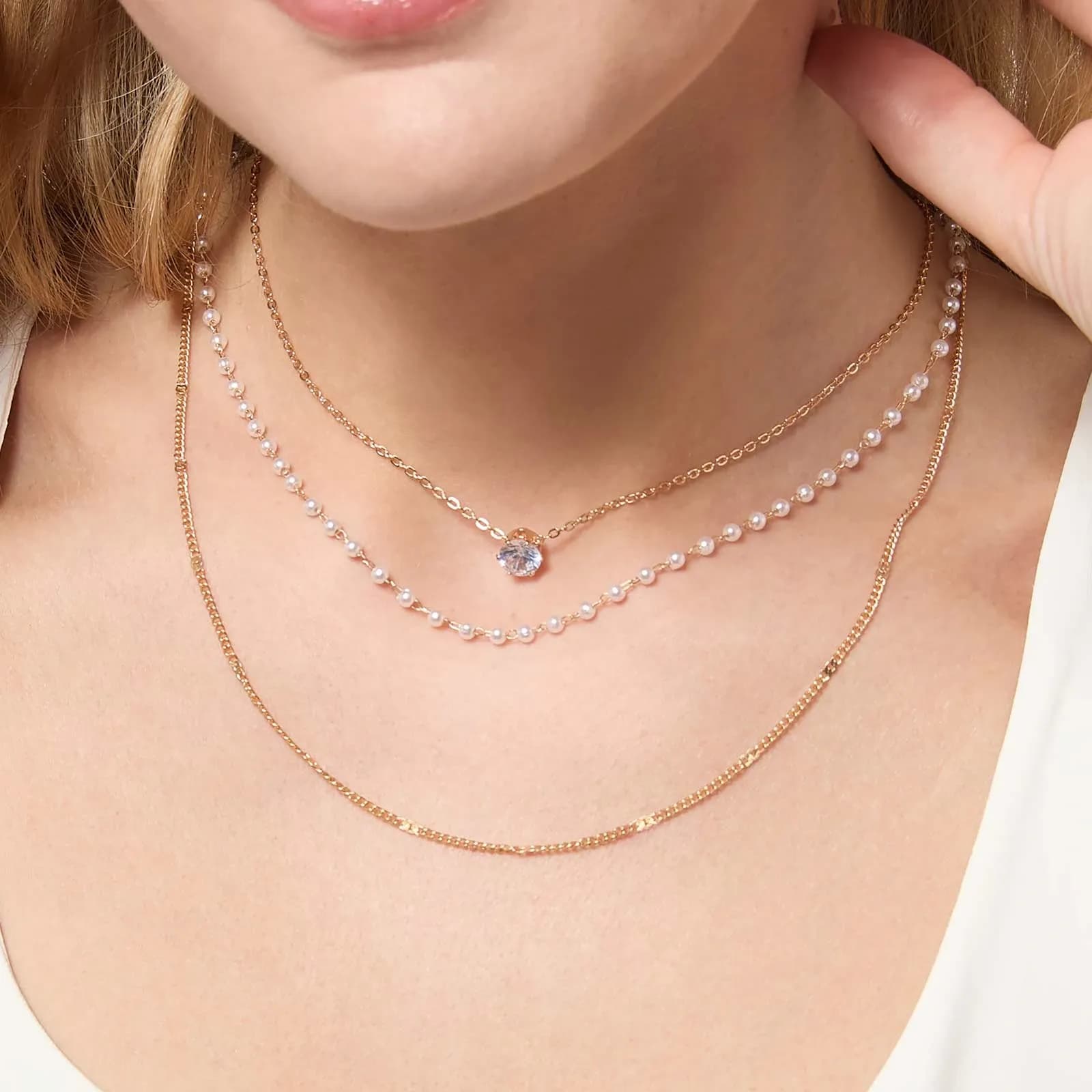 Guldfärgat halsband med tre rader 2