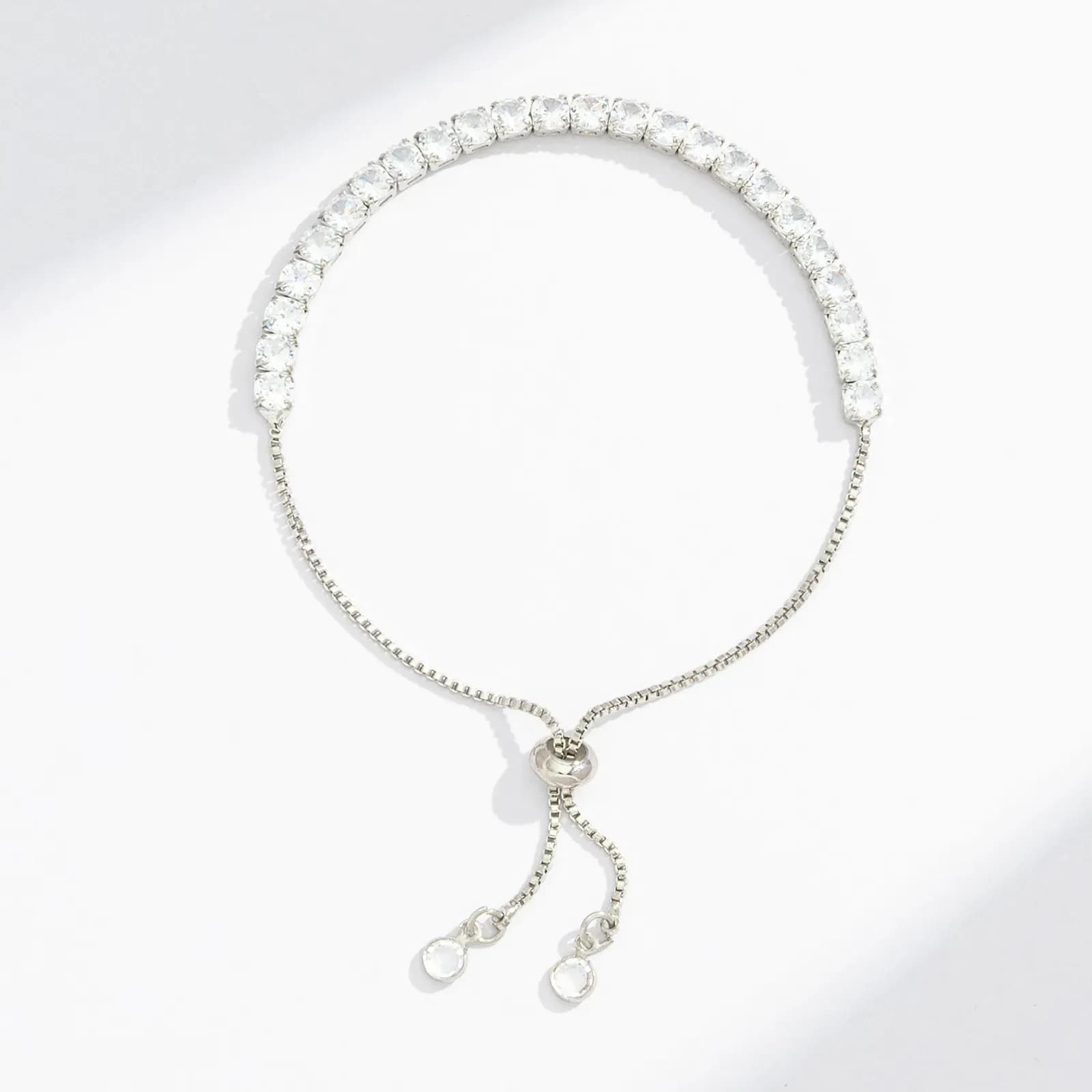 Silverfärgat tennisarmband, klara glasstenar - Justerbar