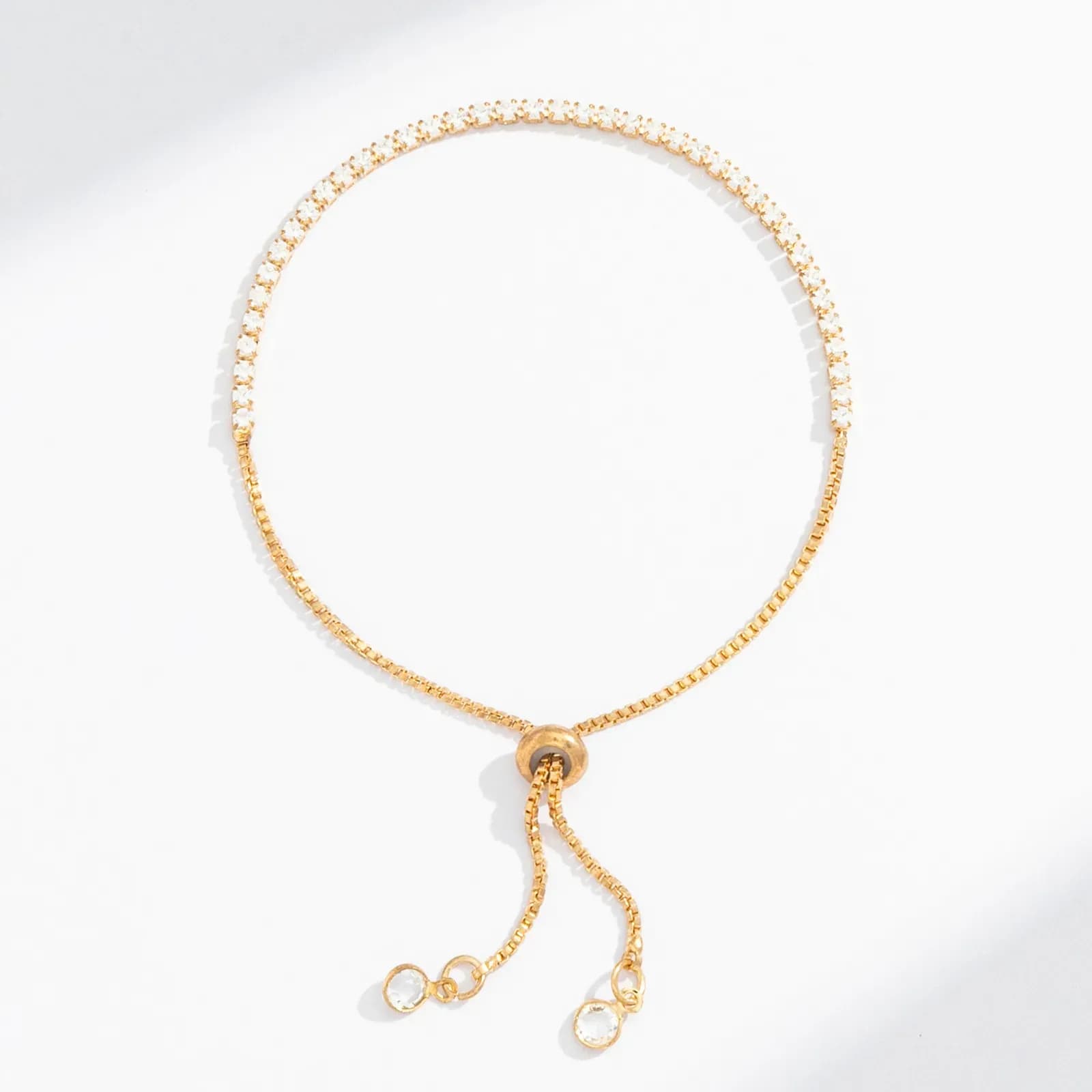 Guldfärgat tennisarmband, klara glasstenar - Justerbar