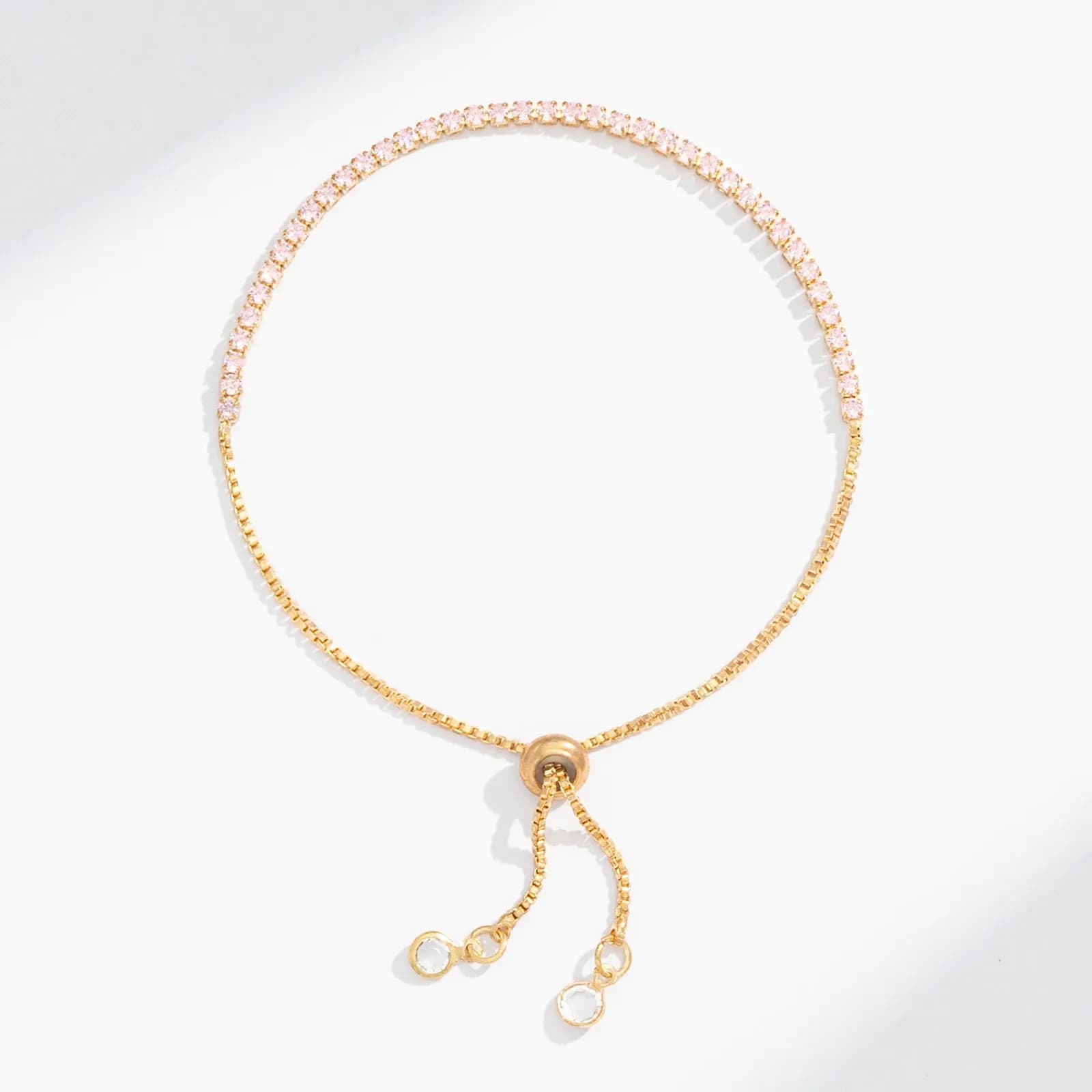 Guldfärgat tennisarmband, ljusrosa glasstenar - Justerbar