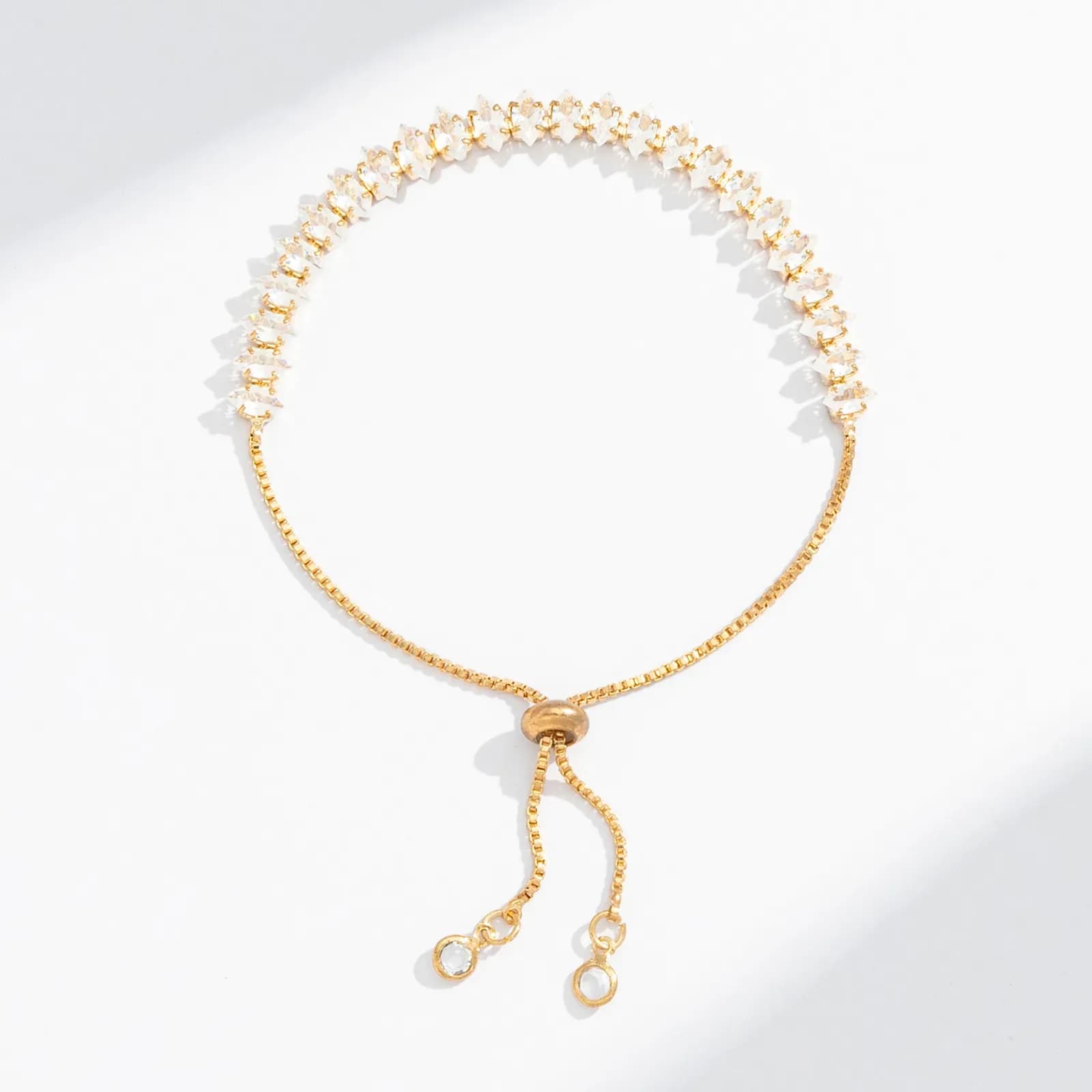 Guldfärgat tennisarmband, ovala glasstenar - Justerbar