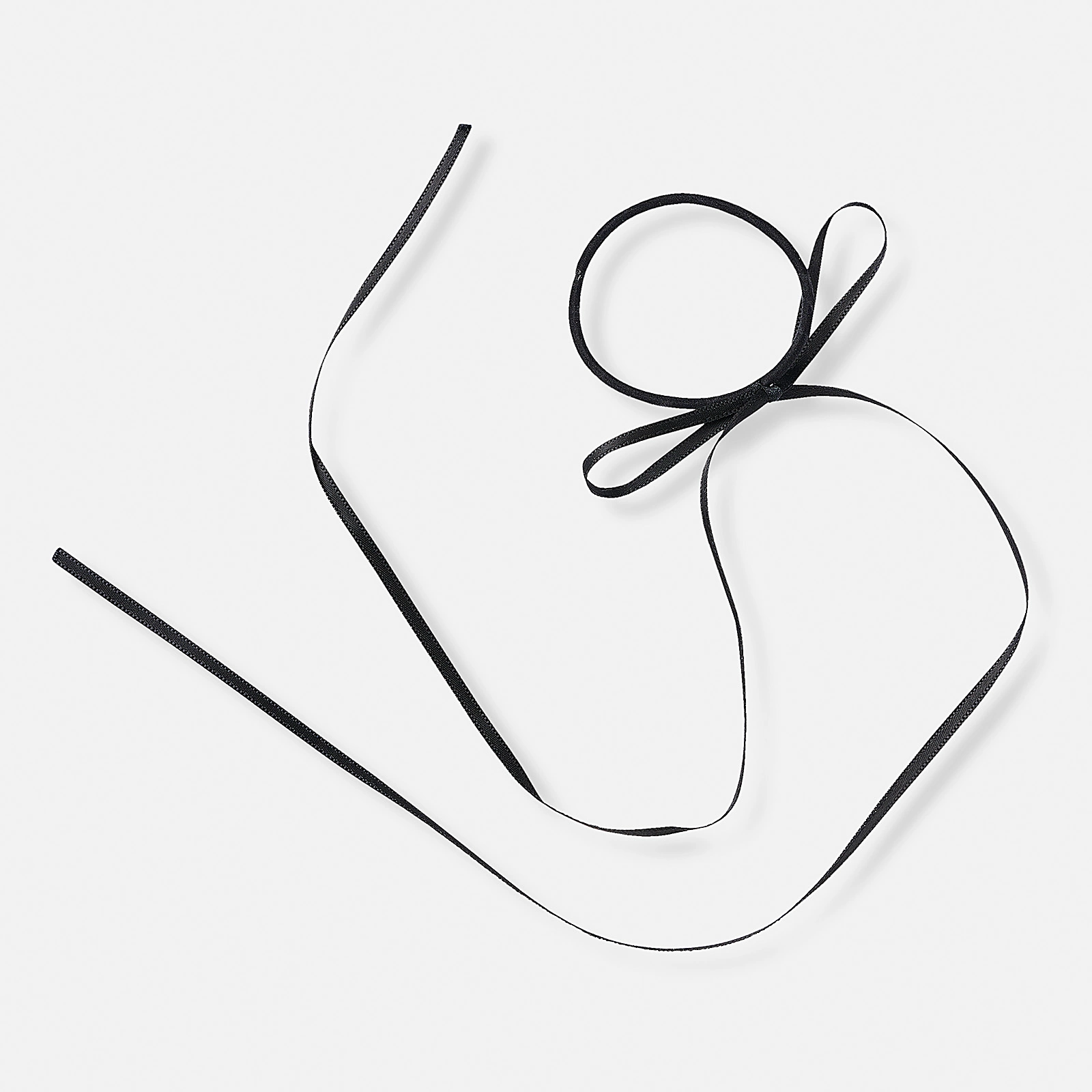 Svart gummisnodd med svart rosett