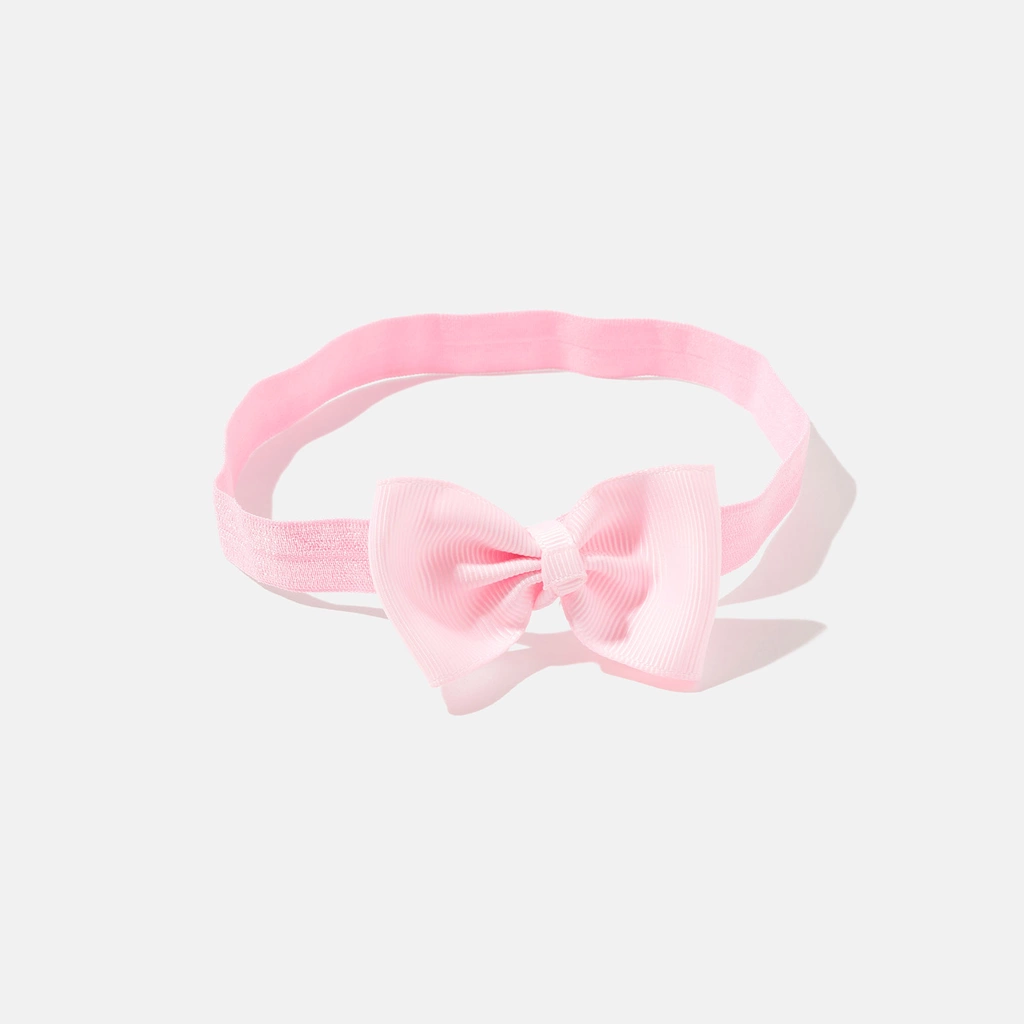 Rosa hårband med rosett