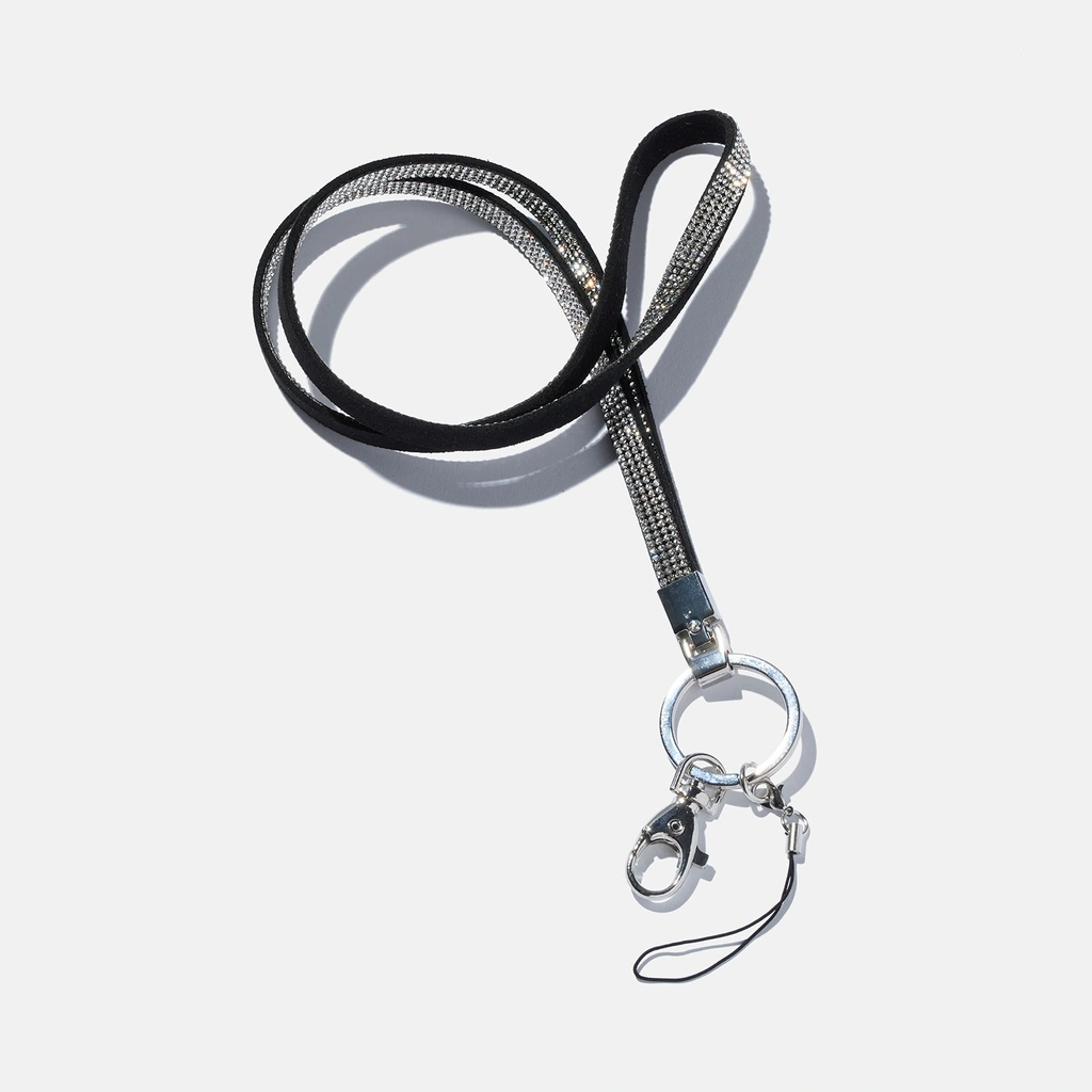 Nyckelring , svart med vitt glitter