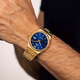 Lotus herrklocka -  datum, guldton/blå, 40 mm