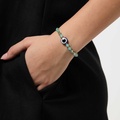 Turkos armband med blått öga