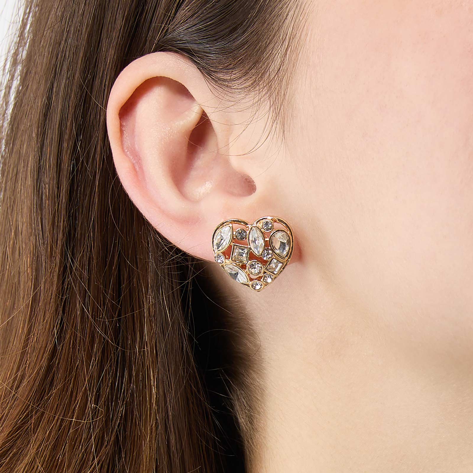 Guldfärgade örhängen - hjärtformade studs med stenar