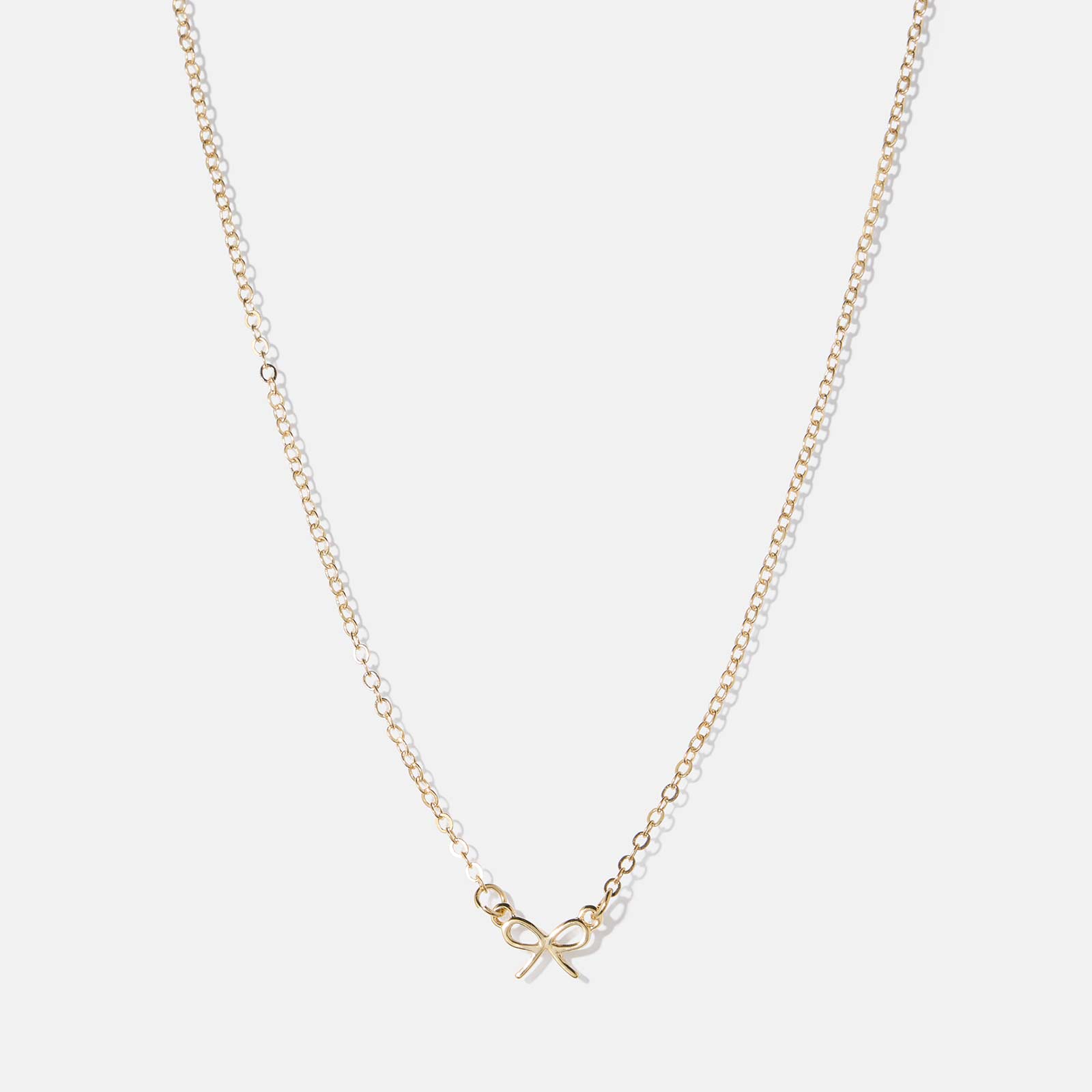 Guldfärgat halsband, sirlig rosett