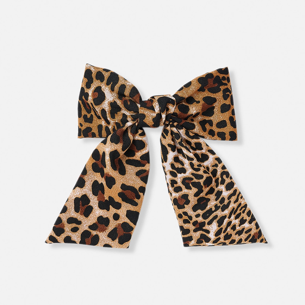 Leopardfärgat hårspänne med rosett