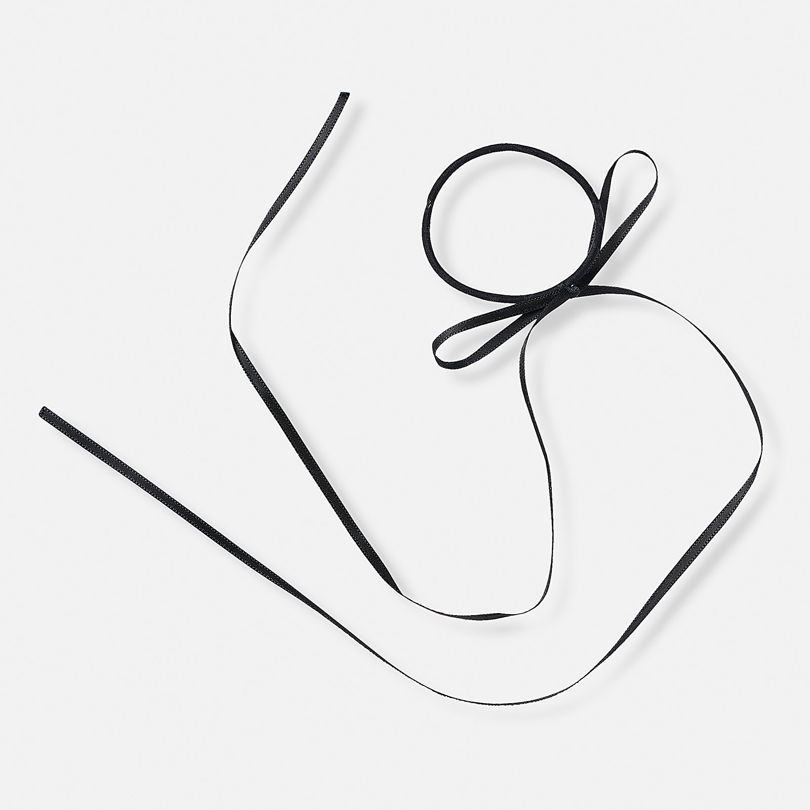 Svart gummisnodd med svart rosett