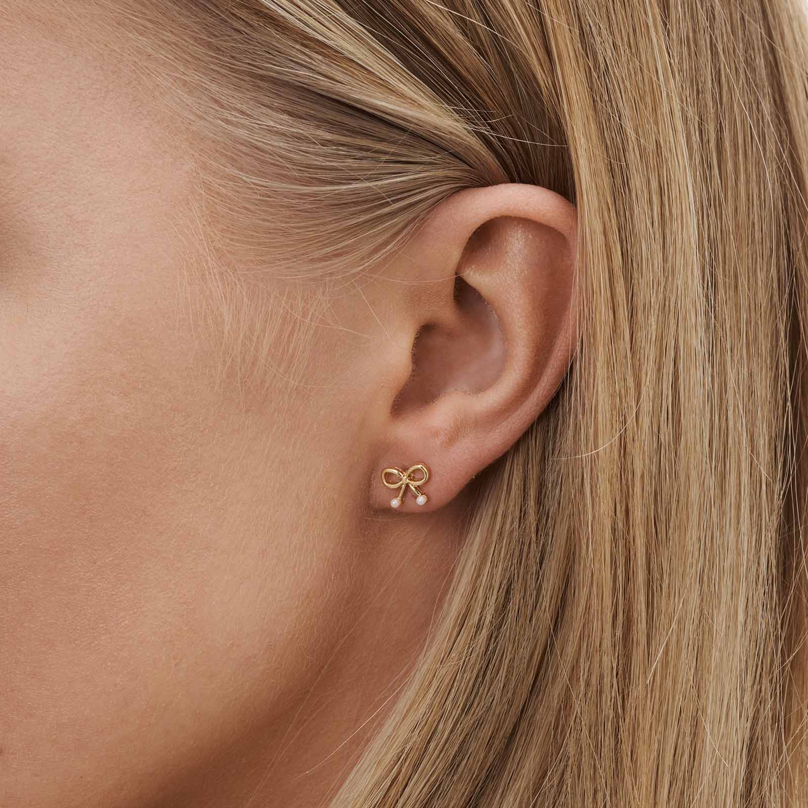 6 guldfärgade studs - olika motiv 1