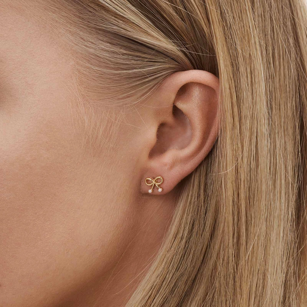 6 guldfärgade studs - olika motiv 1