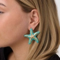 Guldfärgade örhängen, turkosa sjöstjärnor - 50 mm