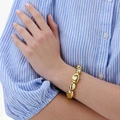 Guldfärgat armband, stora ojämna kulor - 17cm