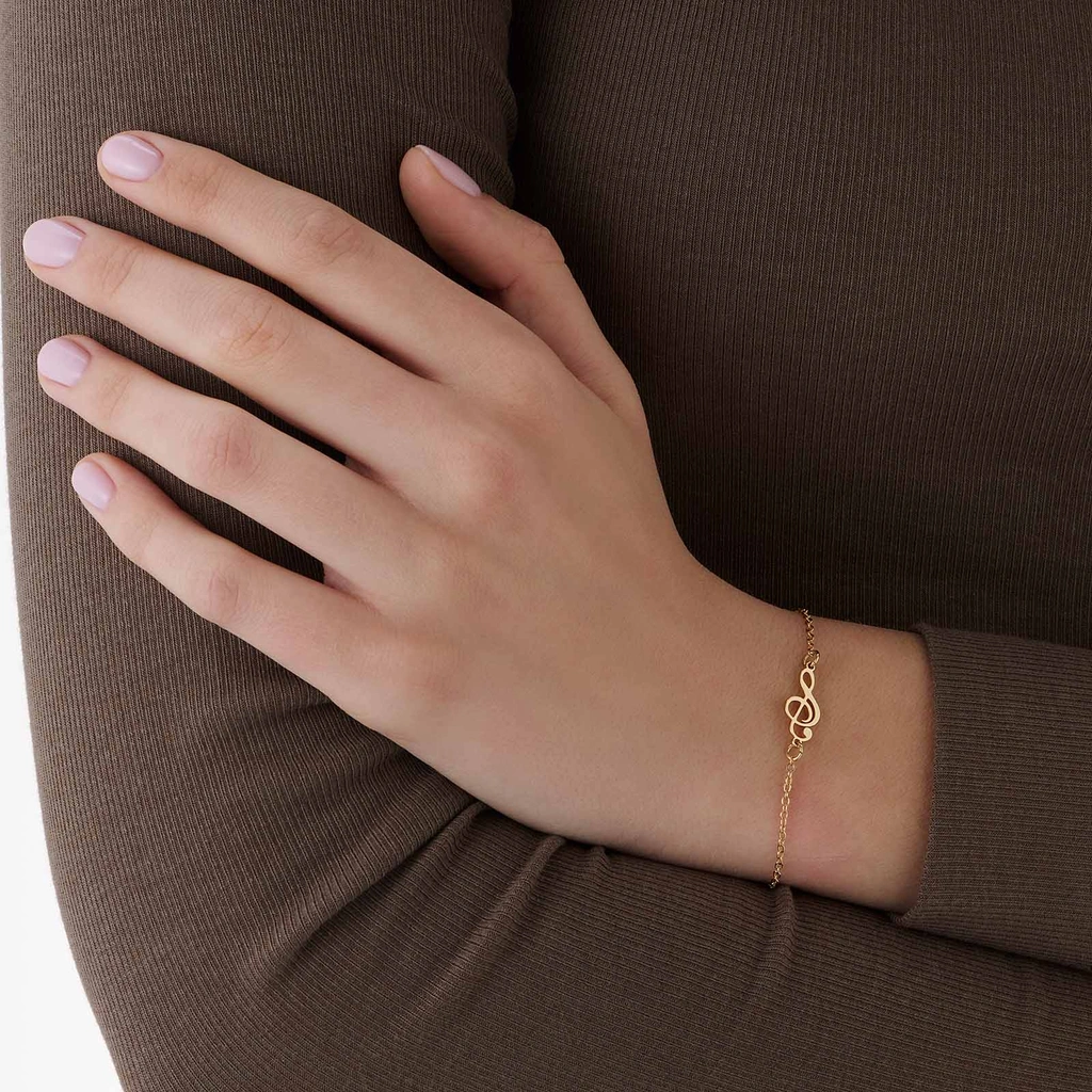 Guldfärgat armband, G-klav - 17+5 cm