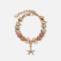 Guldfärgat armband, rosa detaljer & sjöstjärna - 18+5 cm
