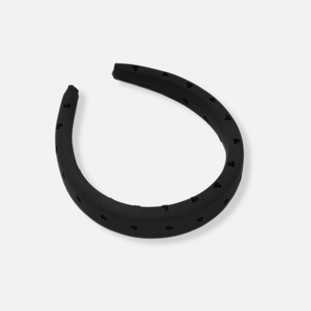 Svart vadderat tygdiadem med prickar