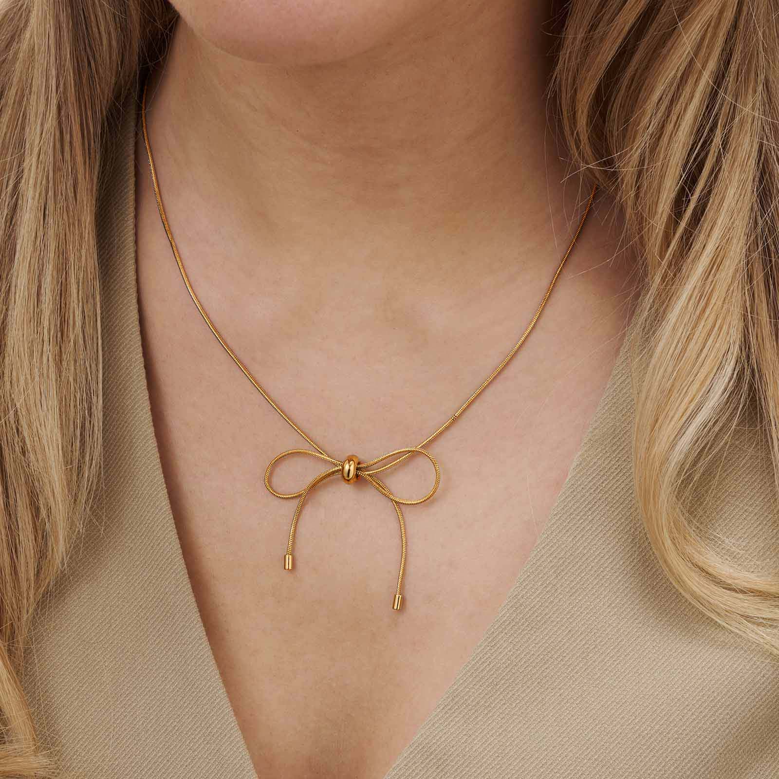 Guldfärgat halsband, ormkedja m rosett, 43+7cm