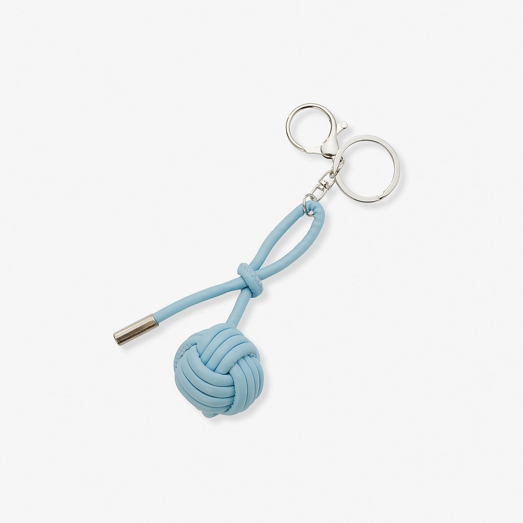 Väskaccessoar - ljusblå knop