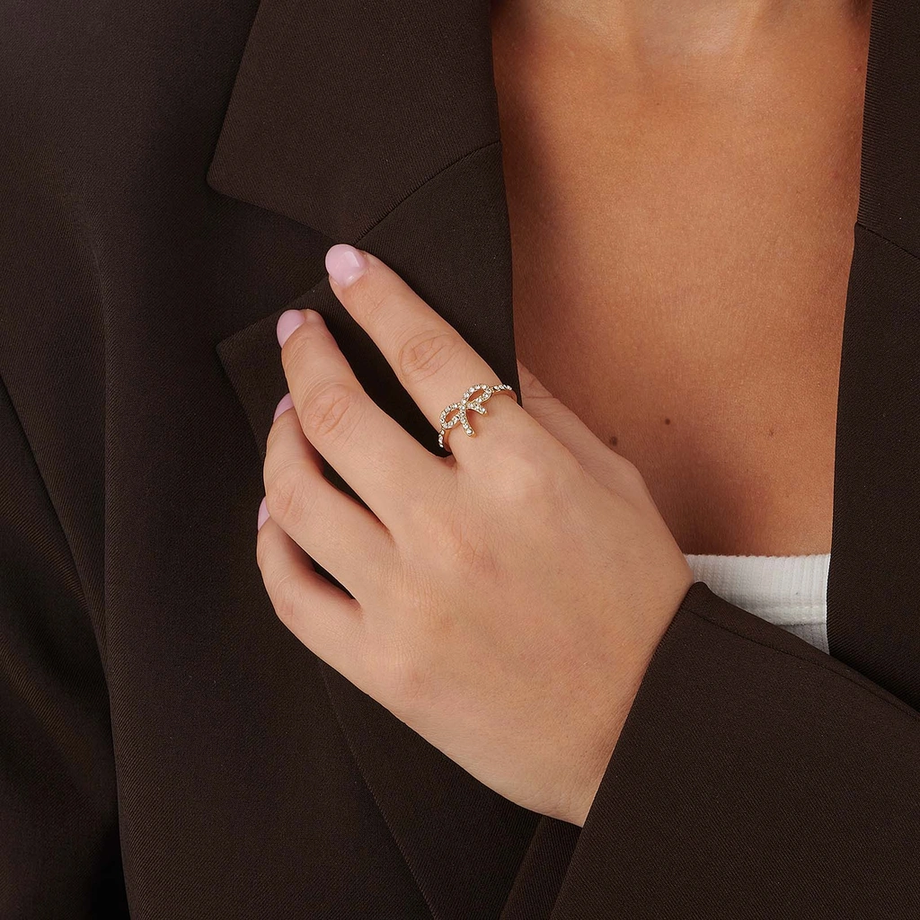 Guldfärgad ring med rosett & vita stenar - 18