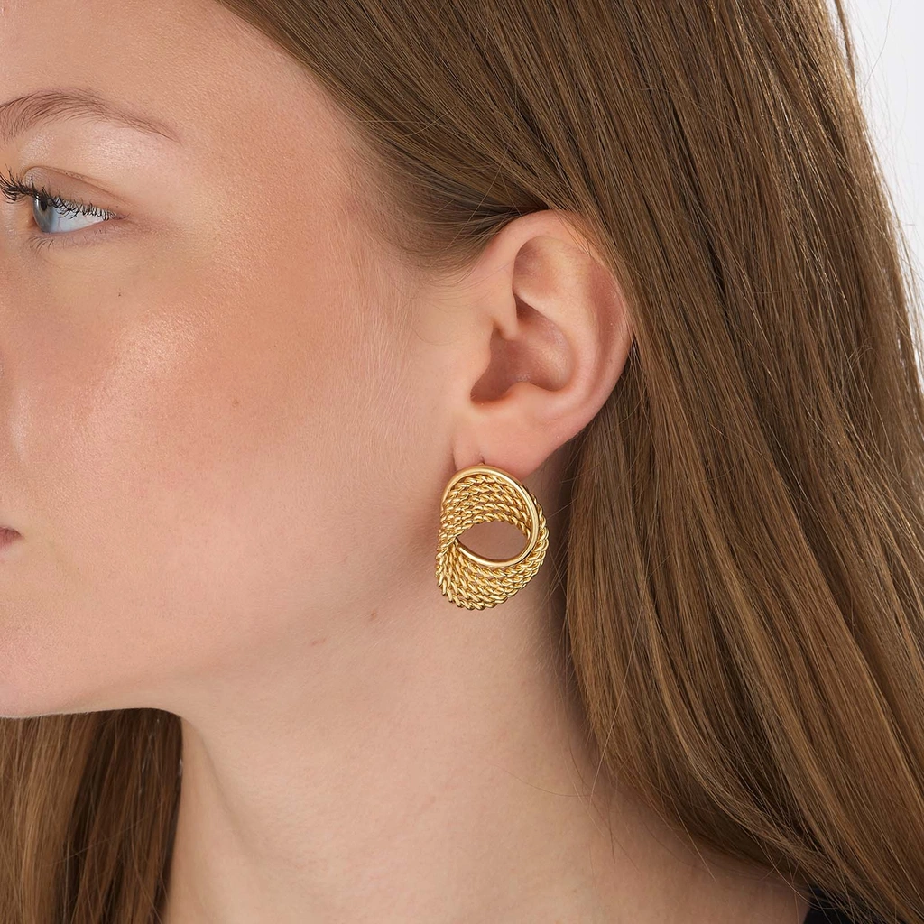 Guldfärgade örhängen, vriden cirkel - 25x30mm