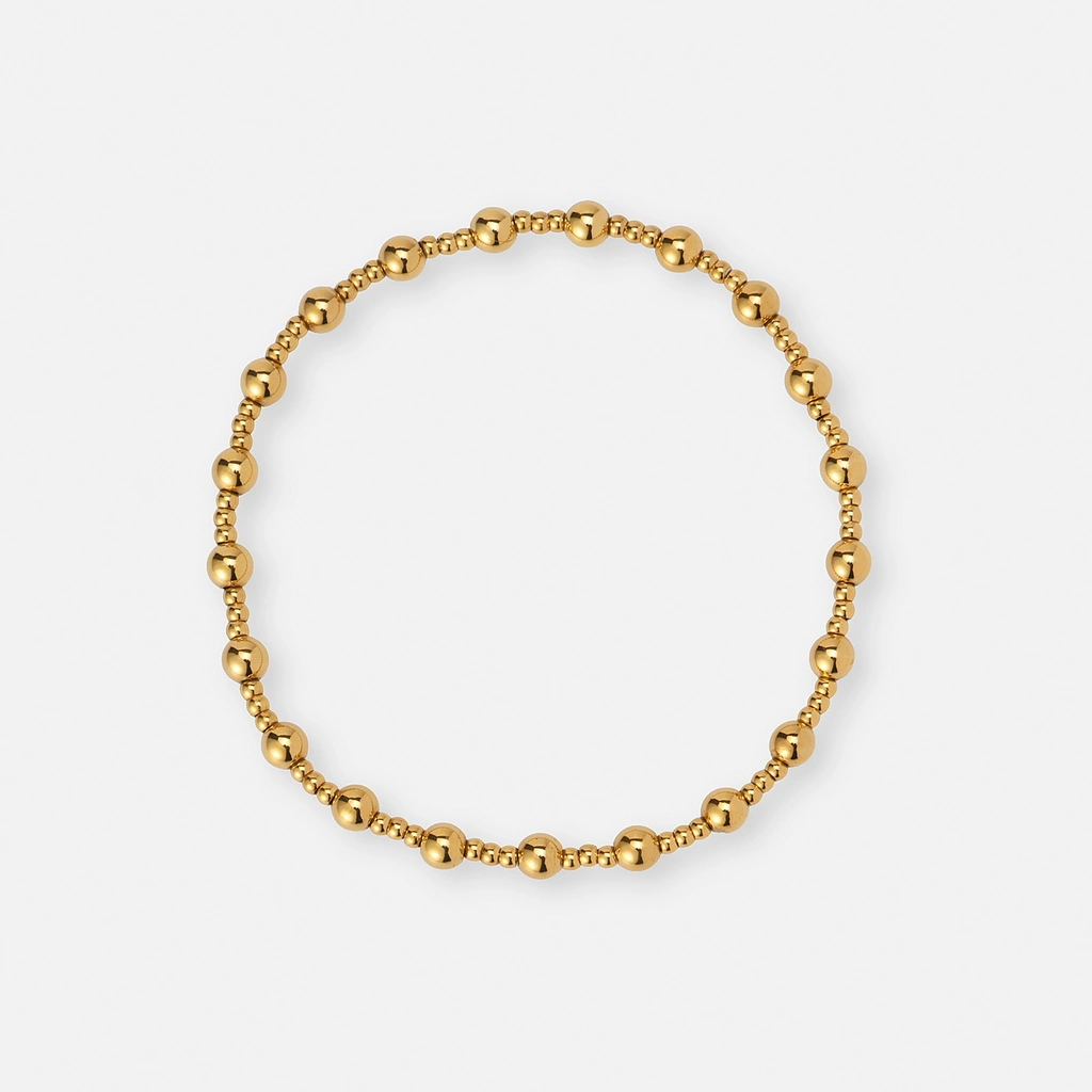 Armband i guldpläterat stål - elastiskt med kulor 2&4mm