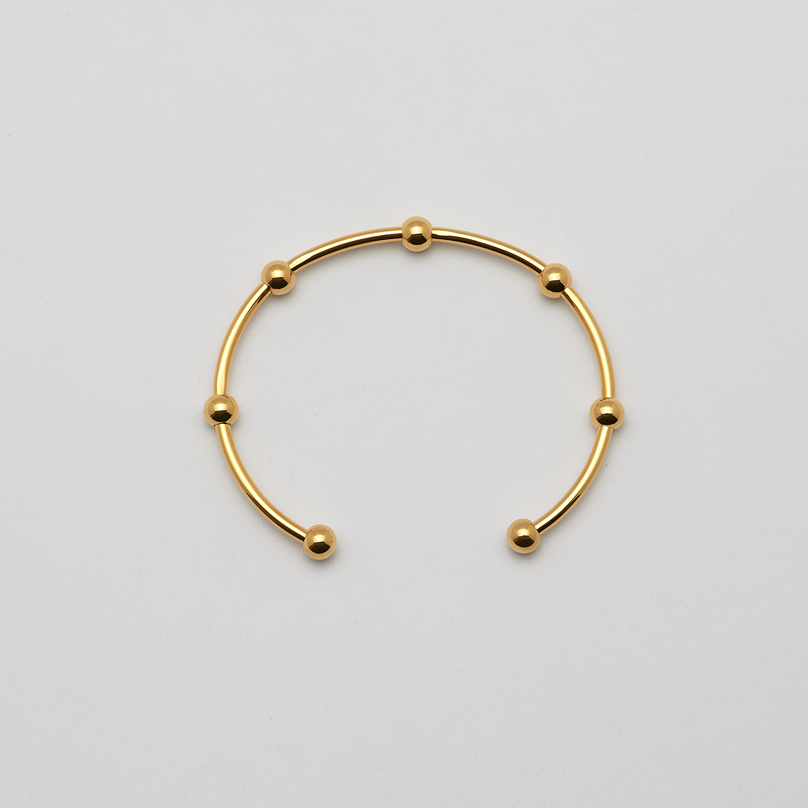 Armband i guldpläterat stål, bangle med bollar - 2,5x66,5 mm