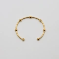 Armband i guldpläterat stål, bangle med bollar - 2,5x66,5 mm